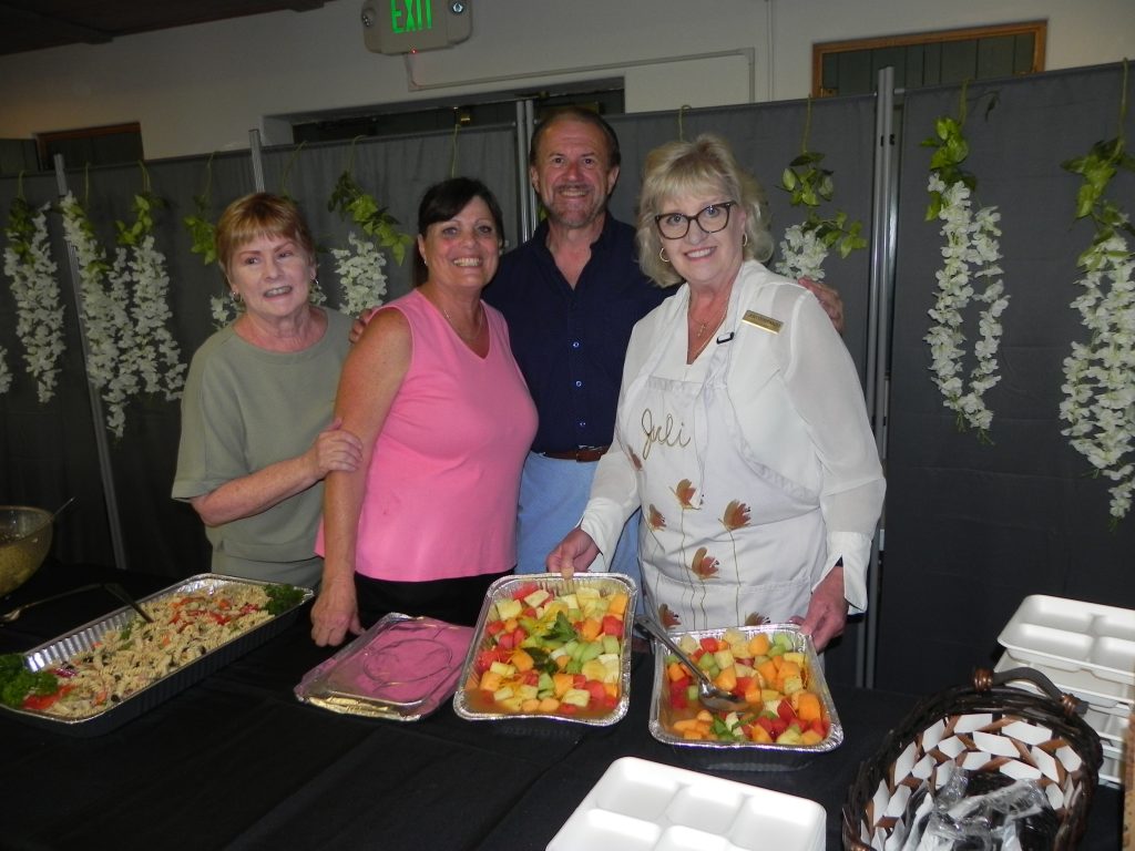 Members of San Gabriel Womens Foundation serving food at an event in June 2025.